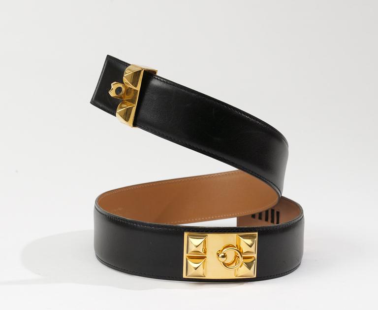 A Hermès black leather belt.