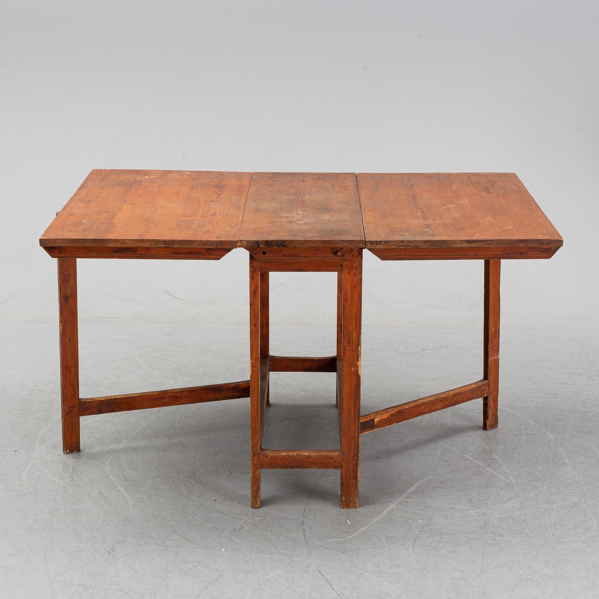 A pine gate leg table, 19th Century.