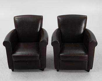A pair of leather upholstered easy chairs, end of the 20th Century.
