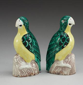 A pair of two green and yellow glazed parrots, Qing dynasty, Jiaqing (1796-1820).