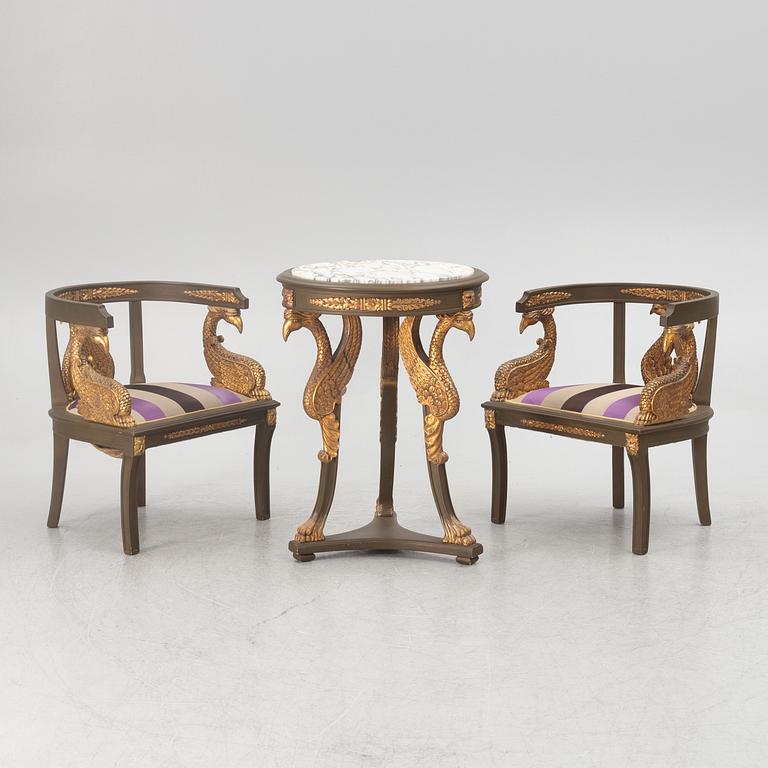A pair of chairs and a side table, second half of the 20th century. Empire style.