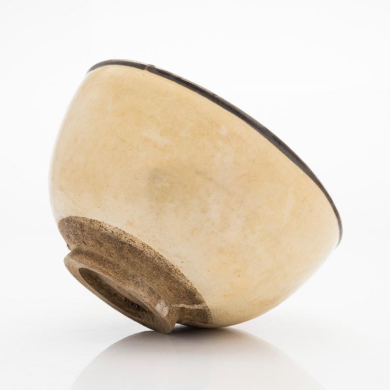 A creme glazed bowl, presumably Song/Yuan dynasty.