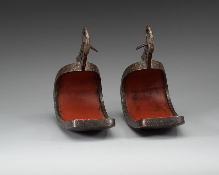 A pair of Japanese silvered bronze stirrups, Meiji (1868-1912).
