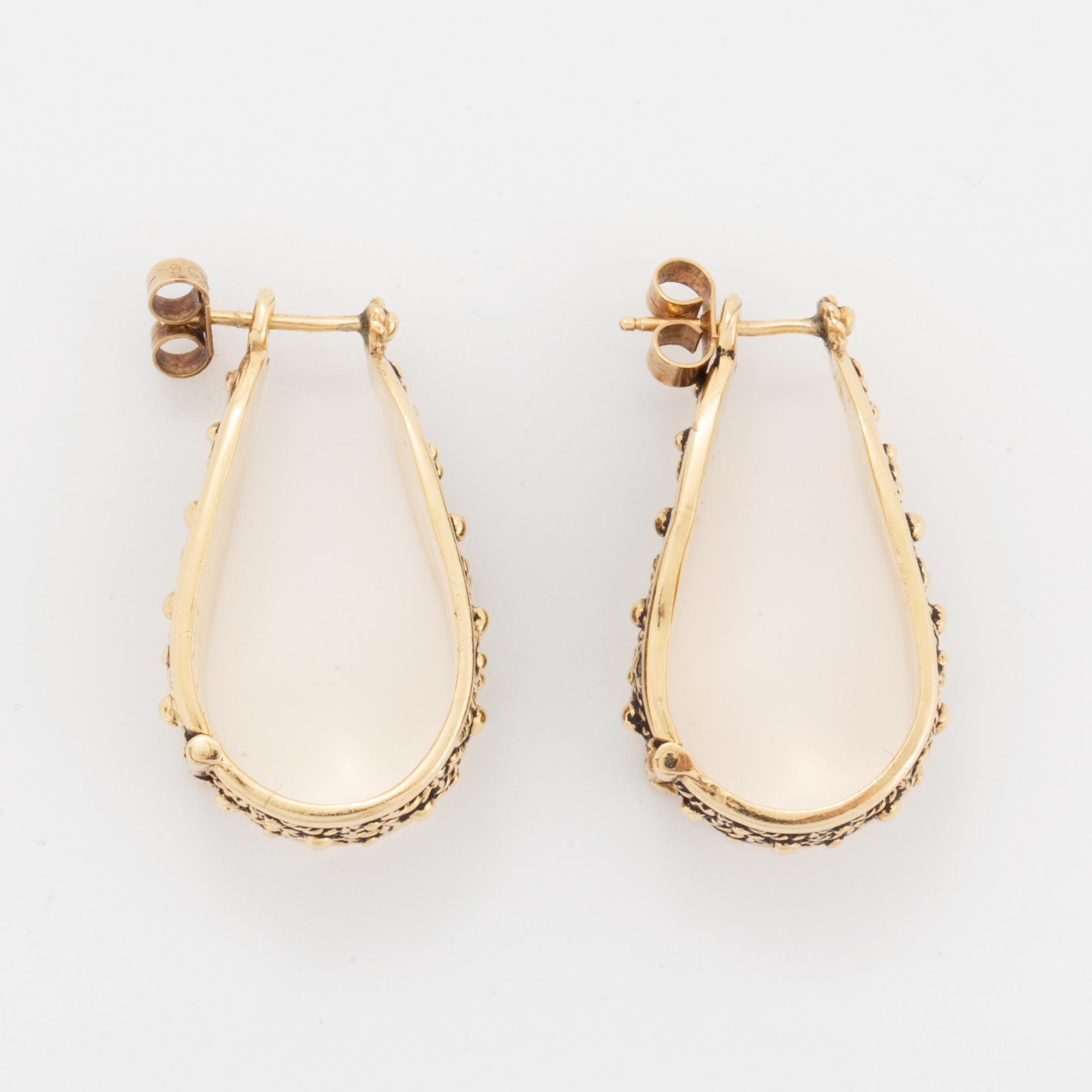 14K gold hoop earrings.