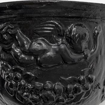 A pair of cast-iron urns.