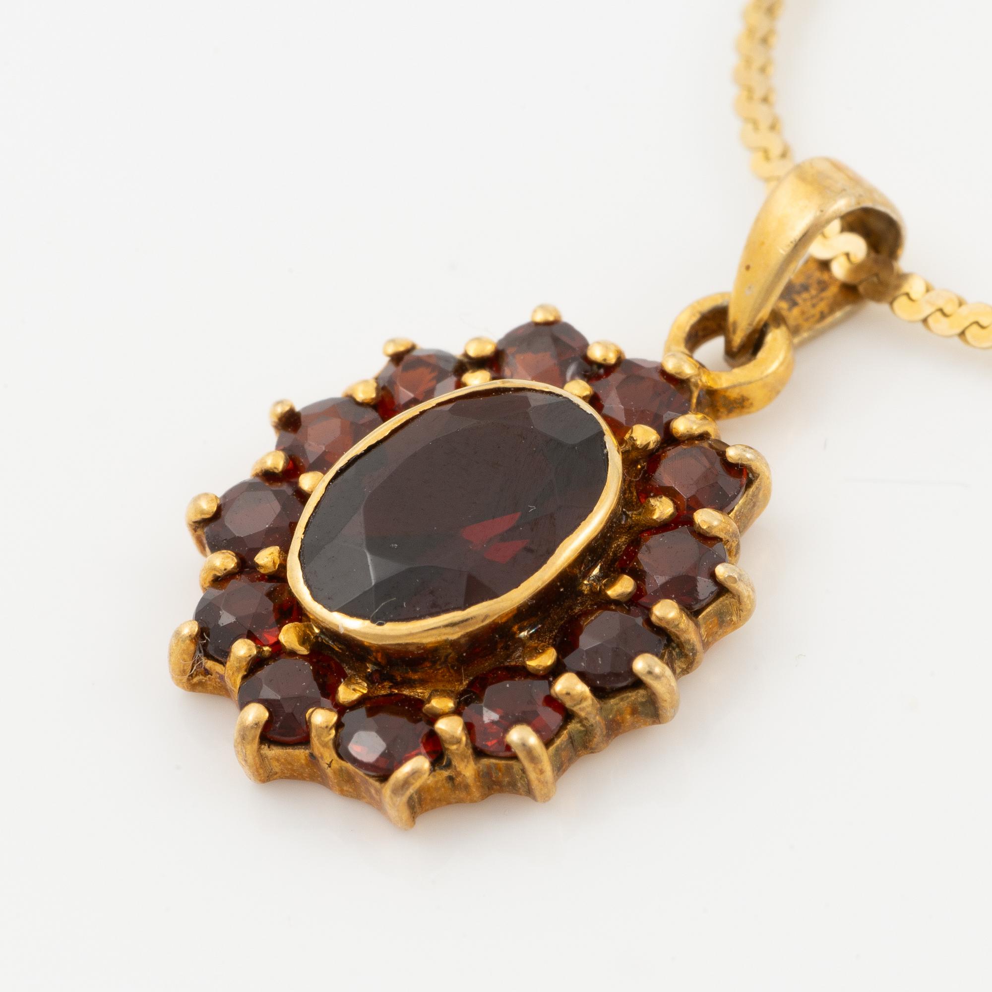 Garniture, two rings, brooch, two necklaces, and two pairs of earrings, armlet, garnets.