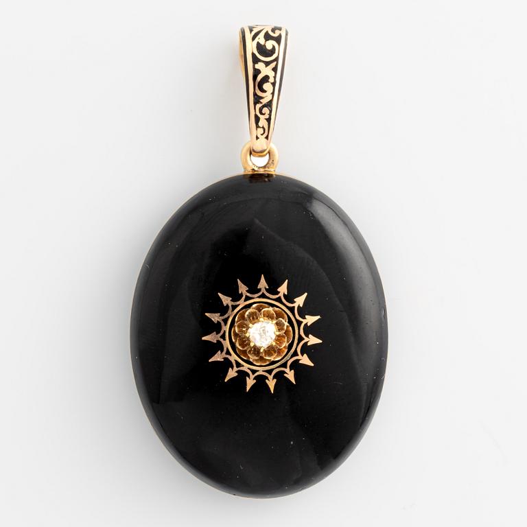 Medallion gold and black enamel with rose-cut diamond.