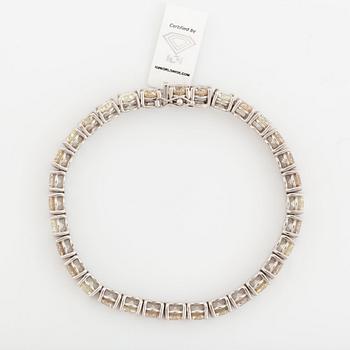 Round brilliant-cut diamond rivière bracelet, with IGI report.