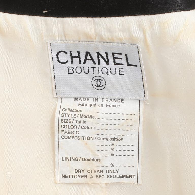 CHANEL, a black and white silk jacket.