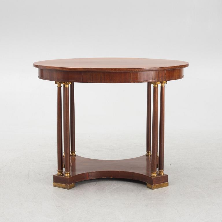 An Empire style table, early 20th Century.
