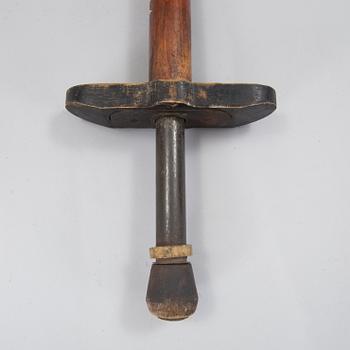 A 20th century wood pogo stick.