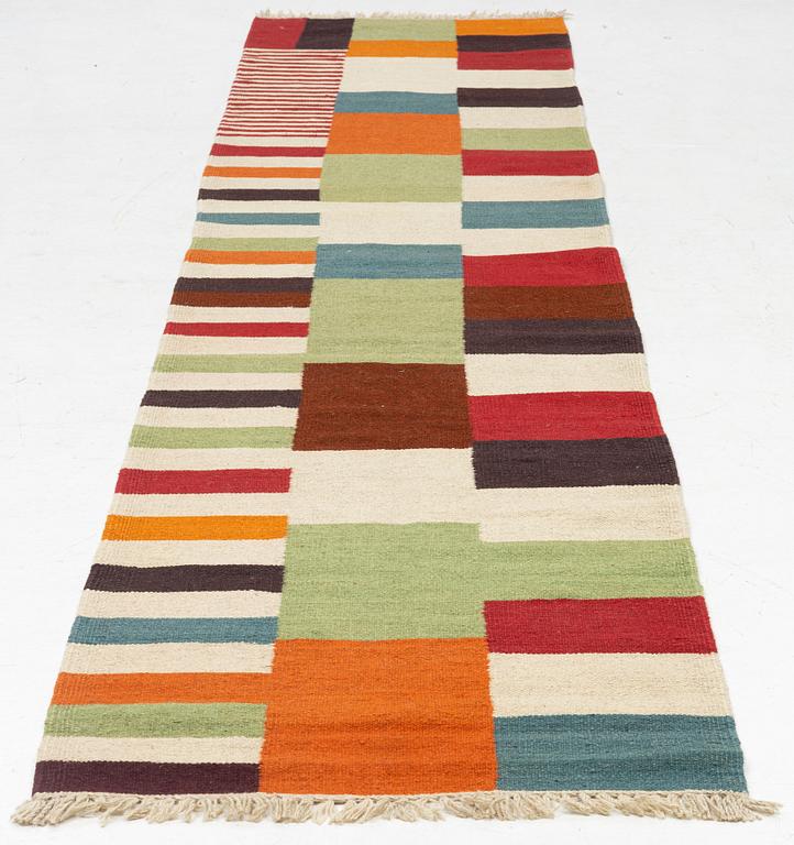 A Kilim runner, c. 388 x 80 cm.