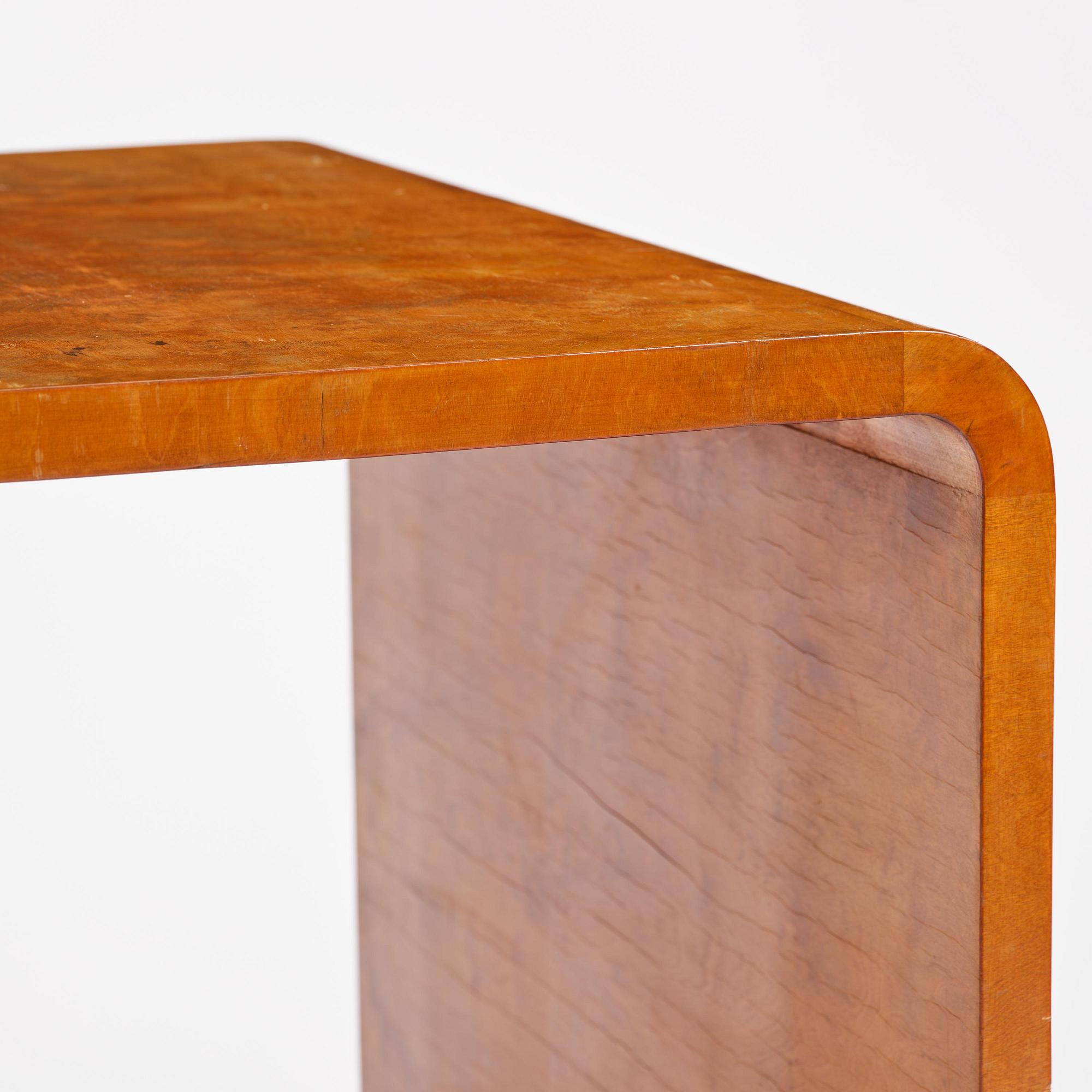 Swedish Modern, a birch veneered coffee table, 1930s-40s.