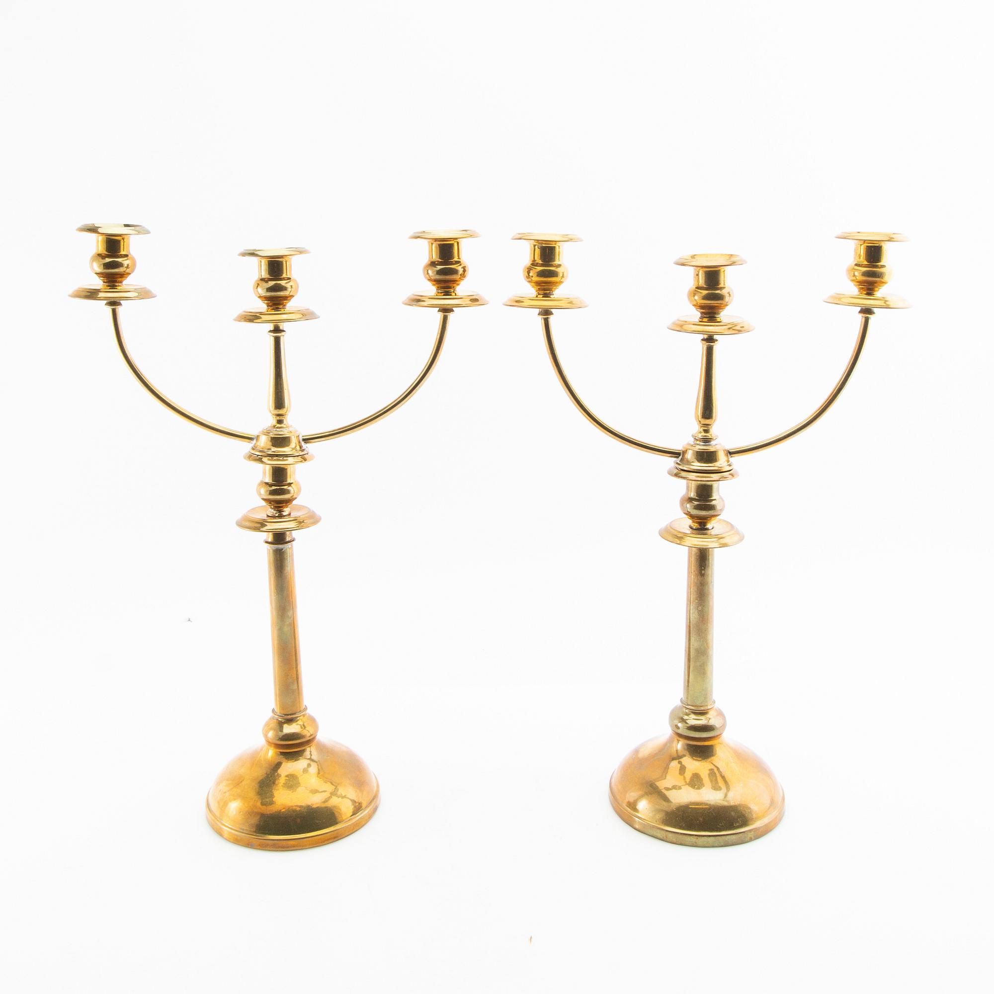 Kandelabrar ett par 1900-talets första hälft.