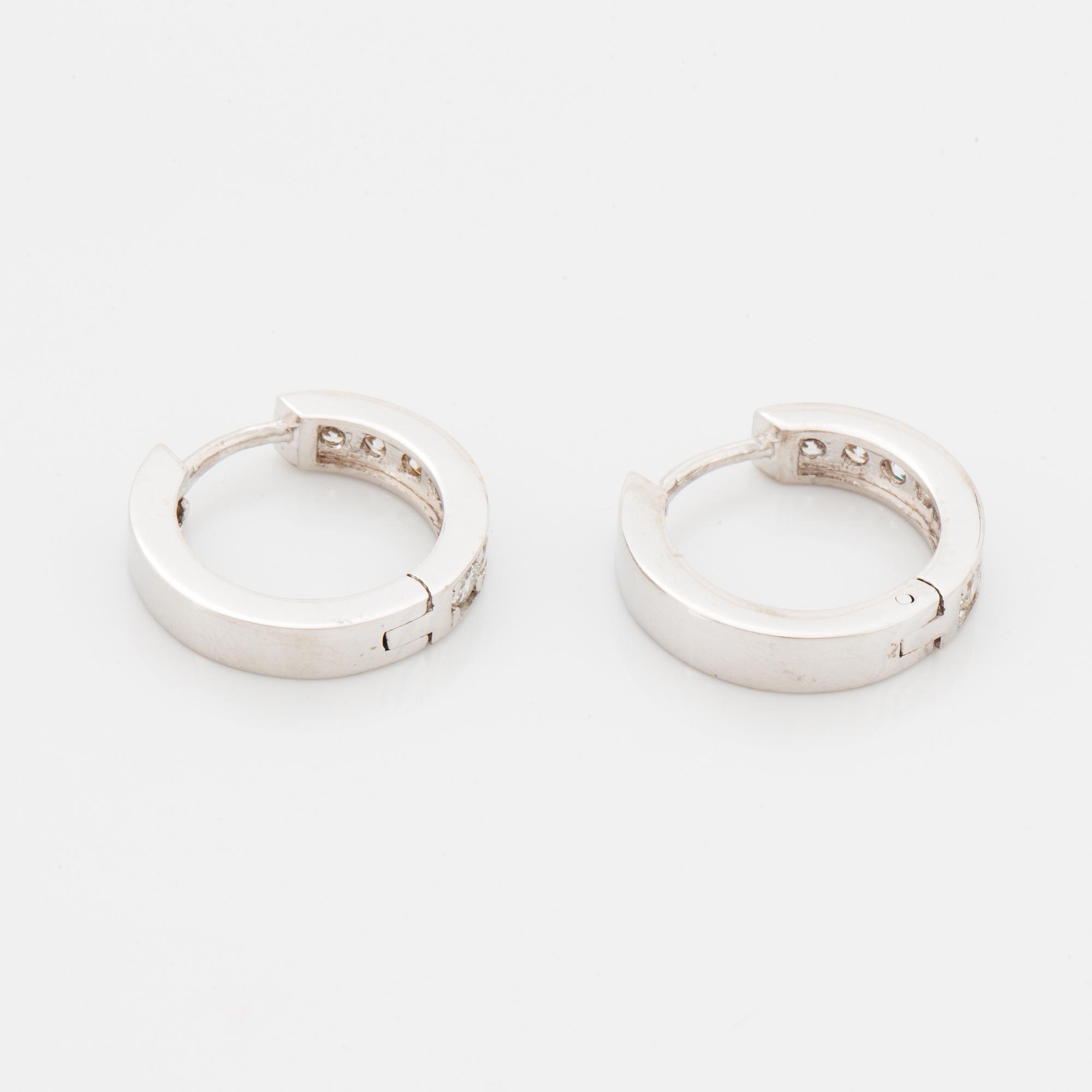 Brilliant-cut diamond  hoop earrings.