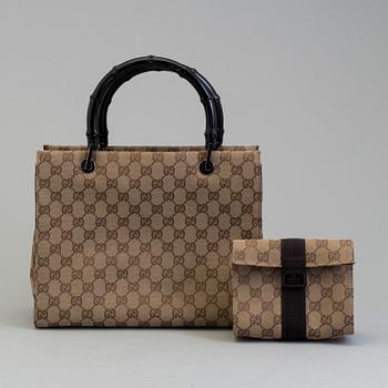 GUCCI, a monogram fabric hand bag and beauty bag.