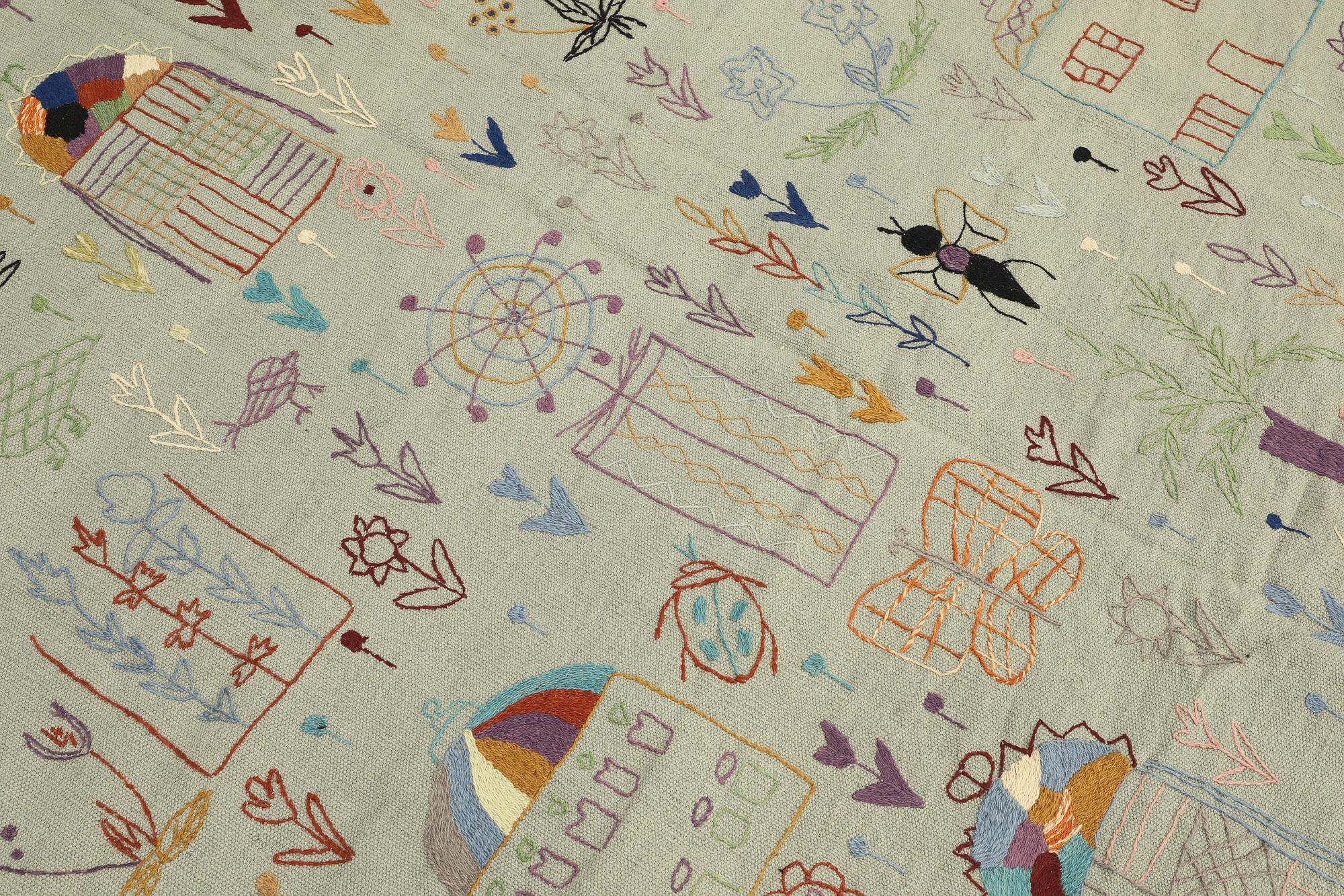 A hand-embroidered Kilim carpet, c. 235 x 178 cm.