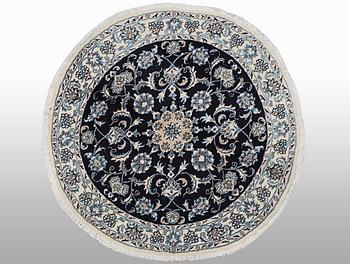 A rug, Nain, part silk, ca 140 x 140 cm.