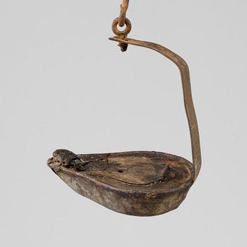 AN 18TH CENTURY CAST IRON OIL LAMP.