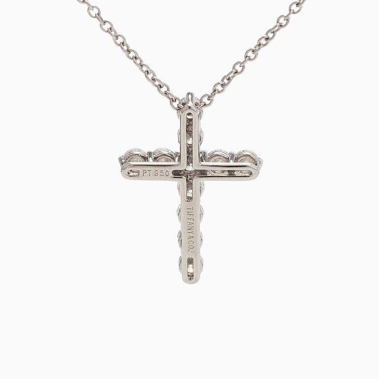 Tiffany & Co, a platinum cross pendant necklace with brilliant-cut diamonds.