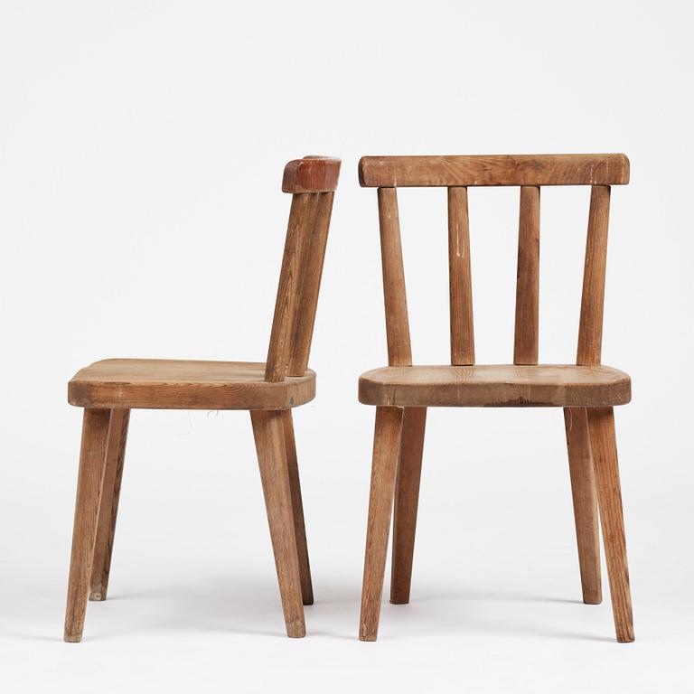 Axel Einar Hjorth, a set of four stained pine "Utö" chairs, Nordiska Kompaniet, Sweden, 1930s.
