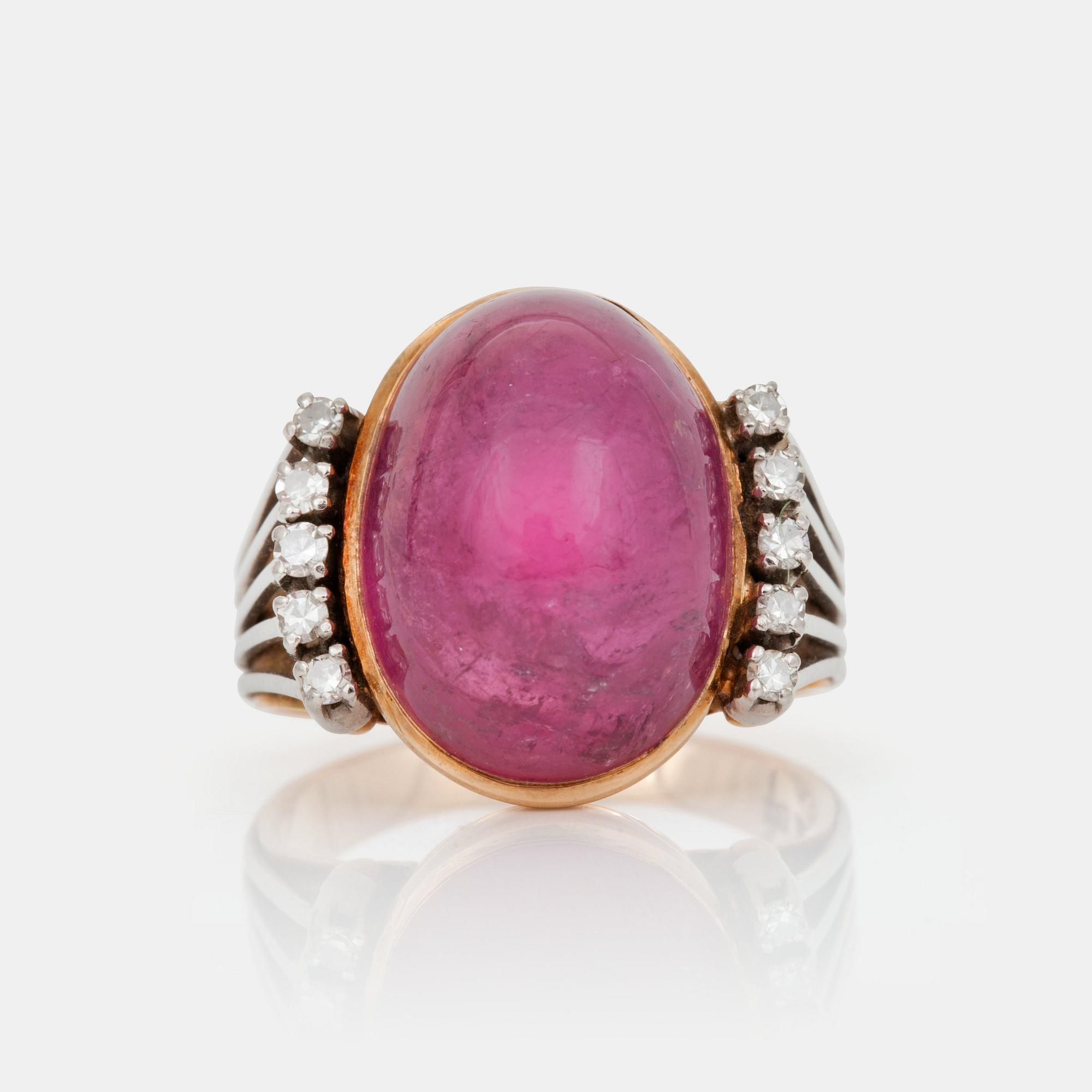 A cabochon-cut tourmaline and brilliant-cut diamond ring.