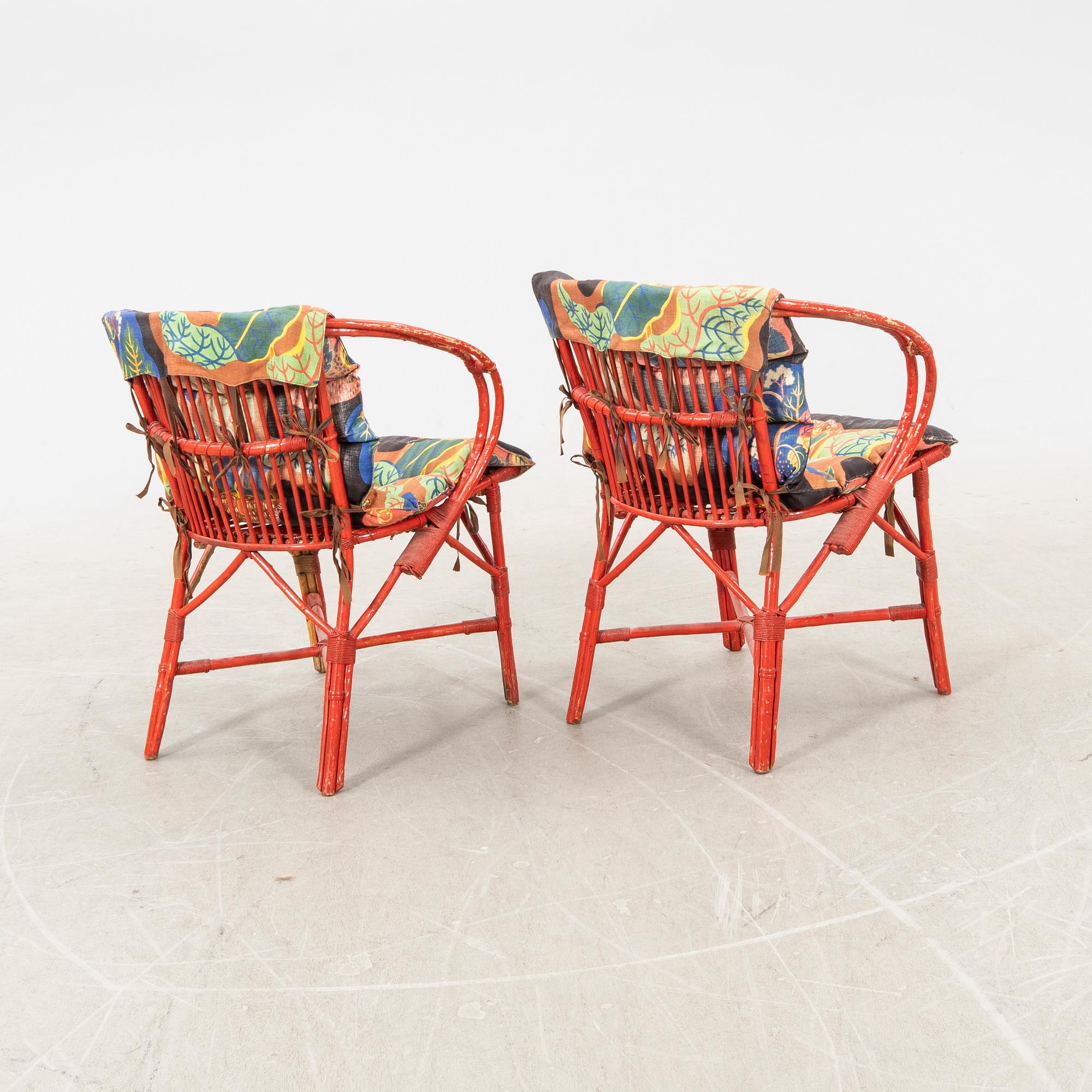 A pair of painted rattan armchairs possibly by Svenskt Tenn.