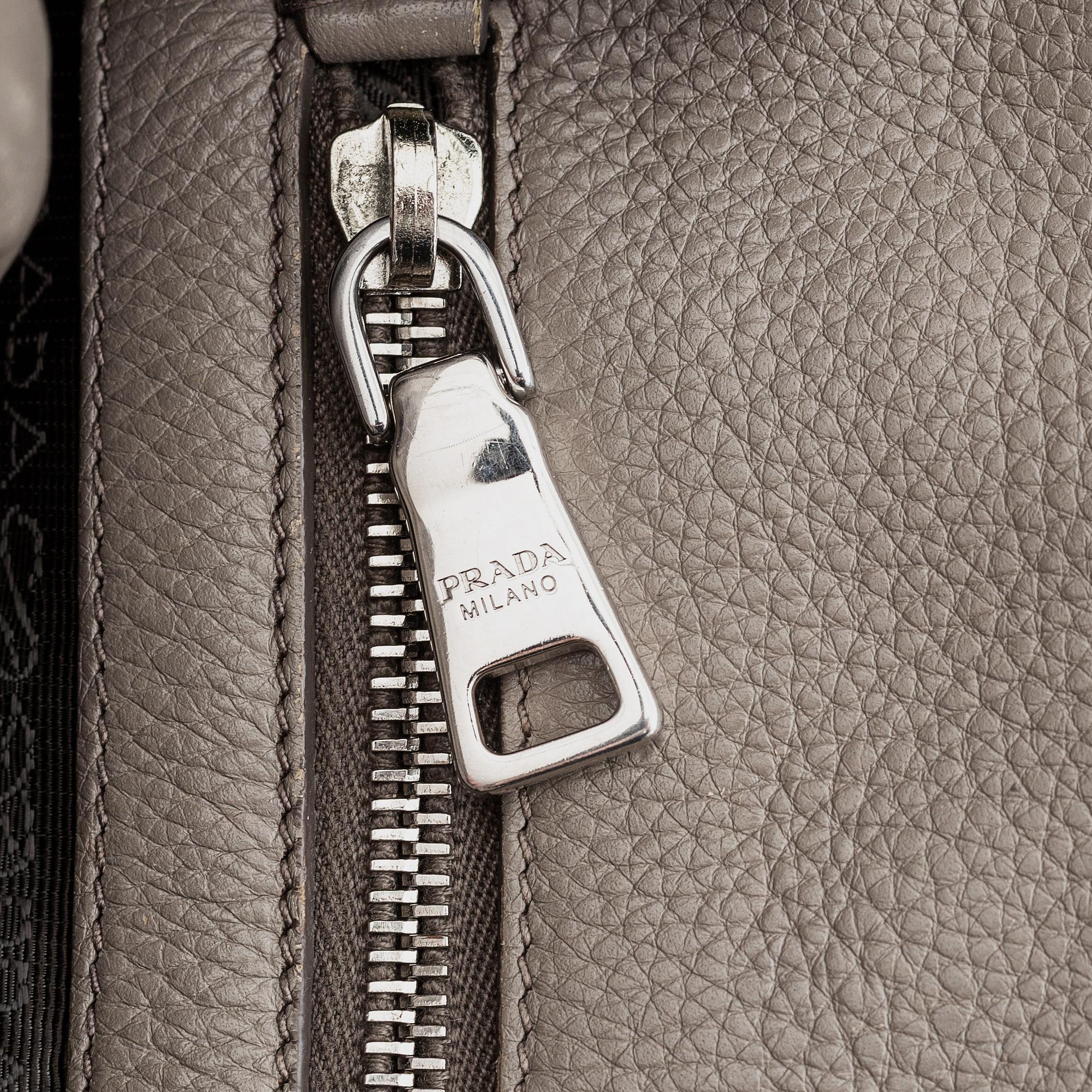 Prada, a leather handbag.