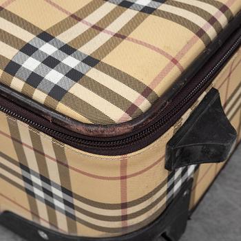 Burberry, a Nova Check canvas suitcase.