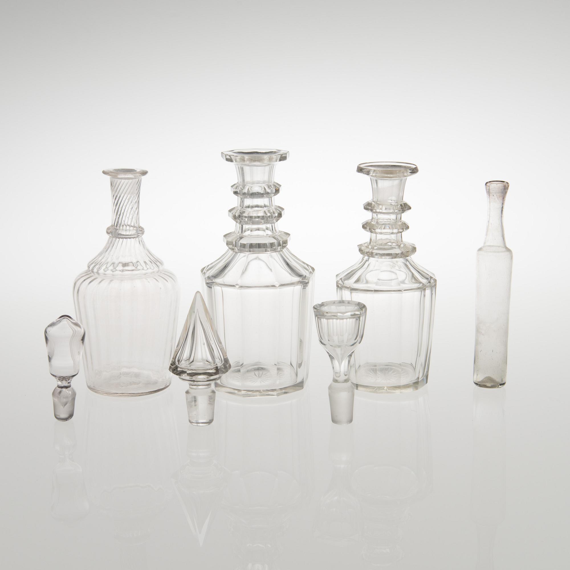 Three carafes and a glass bottle from the end of the 19th century.