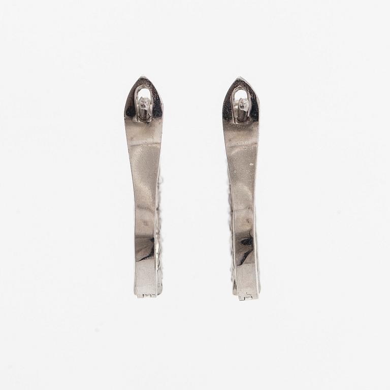A pair of  14K gold earrings, with  brilliant-cut diamonds totalling approximately 0.56 ct.
