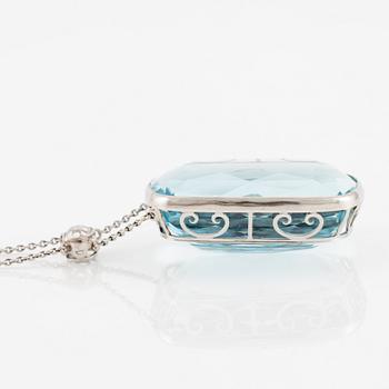 A platinum necklace with a faceted aquamarine and an oval old-cut diamond.