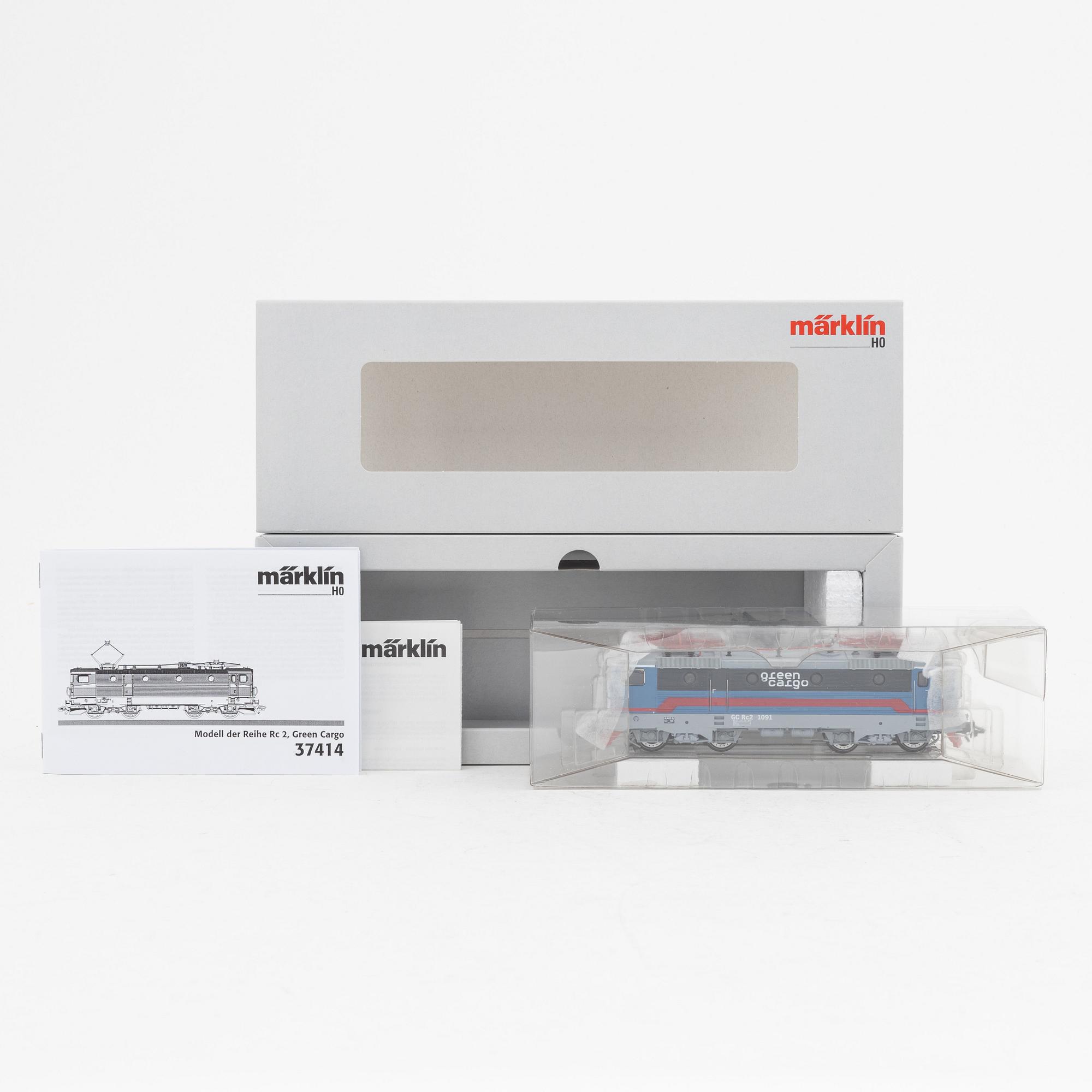 Märklin, an electrical locomotive and 9 passenger cars, gauge H0, i boxes.