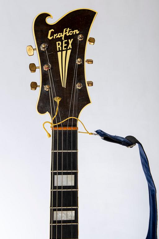 A Crafton Rex acoustic guitar.