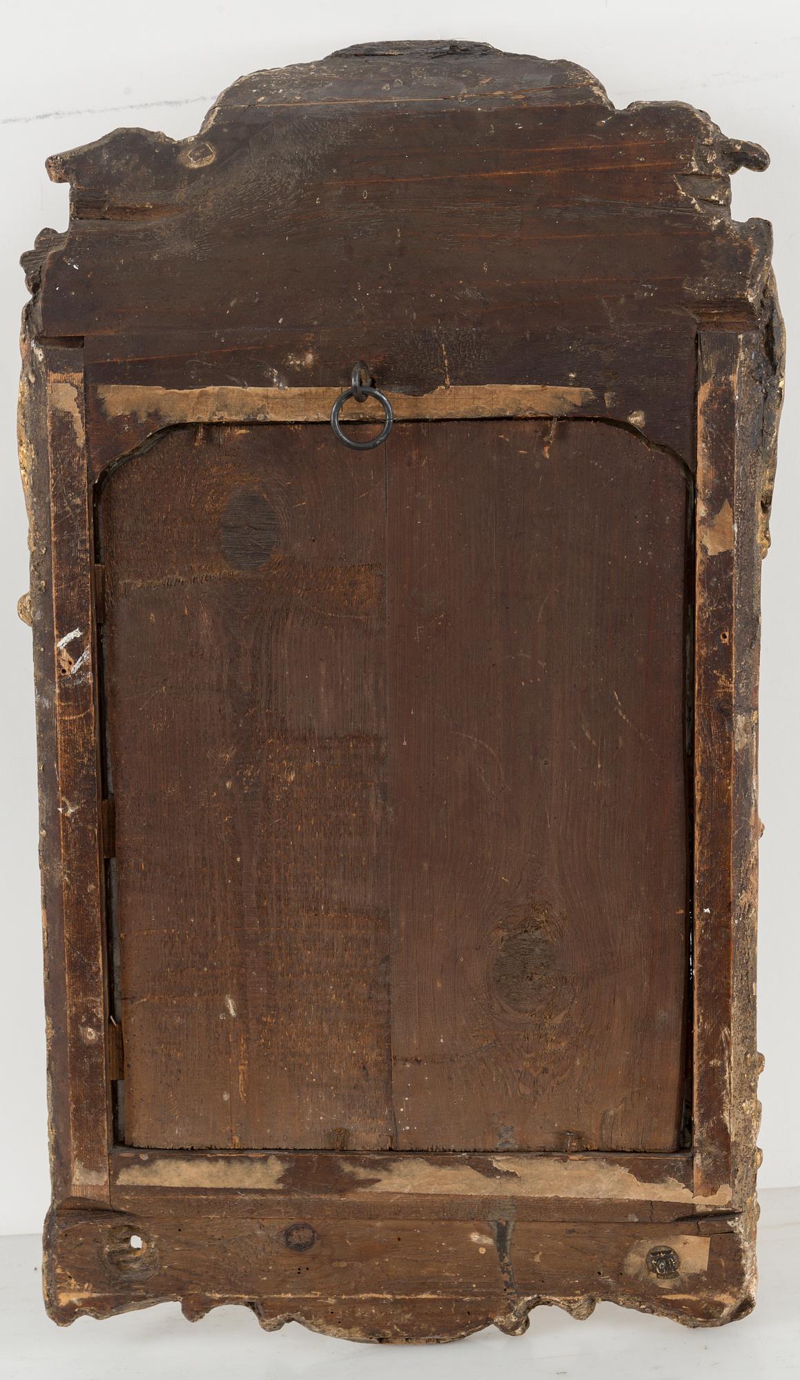 A second half of the 18th century rococo mirror sconce.