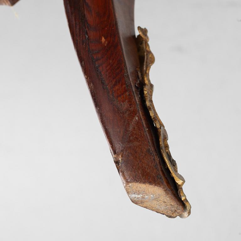 A Swedish rosewood-veneered Rococo chest of drawers, later part of the 18th century.