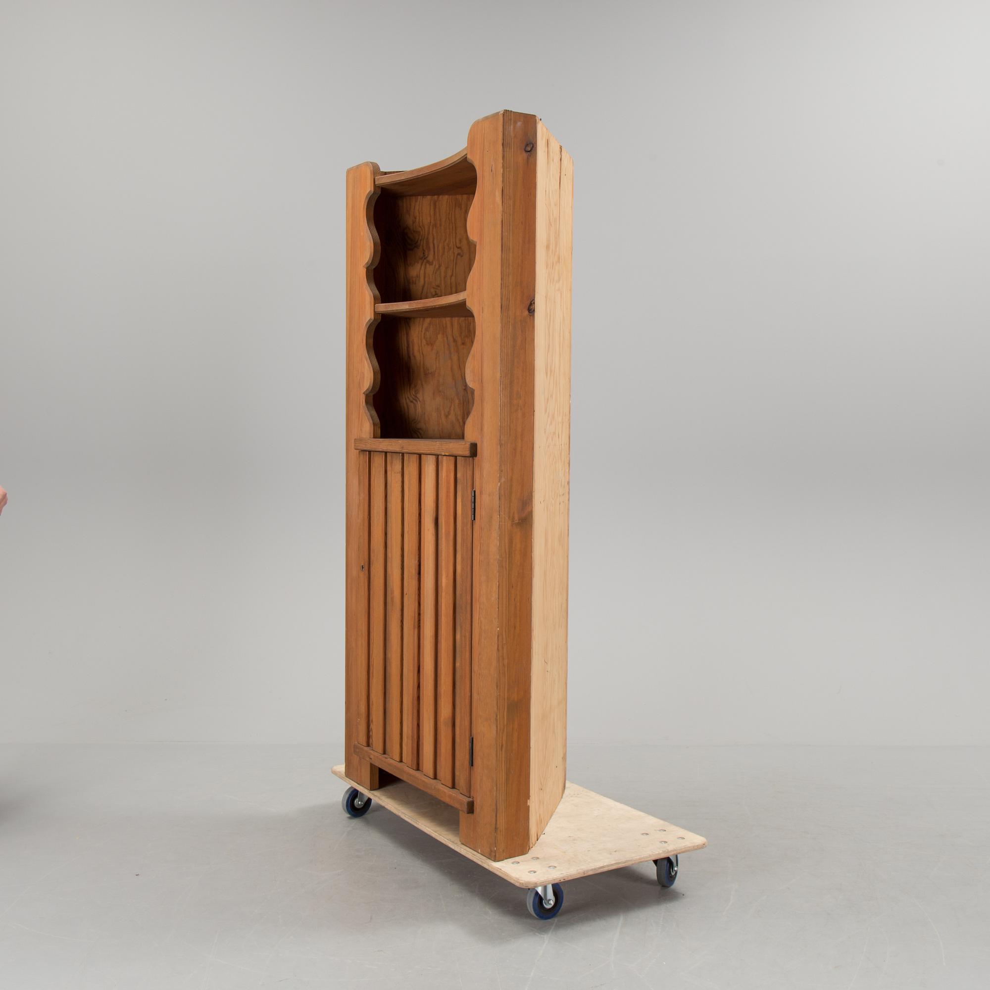 A corner cabinet by Axel Einar Hjorth.