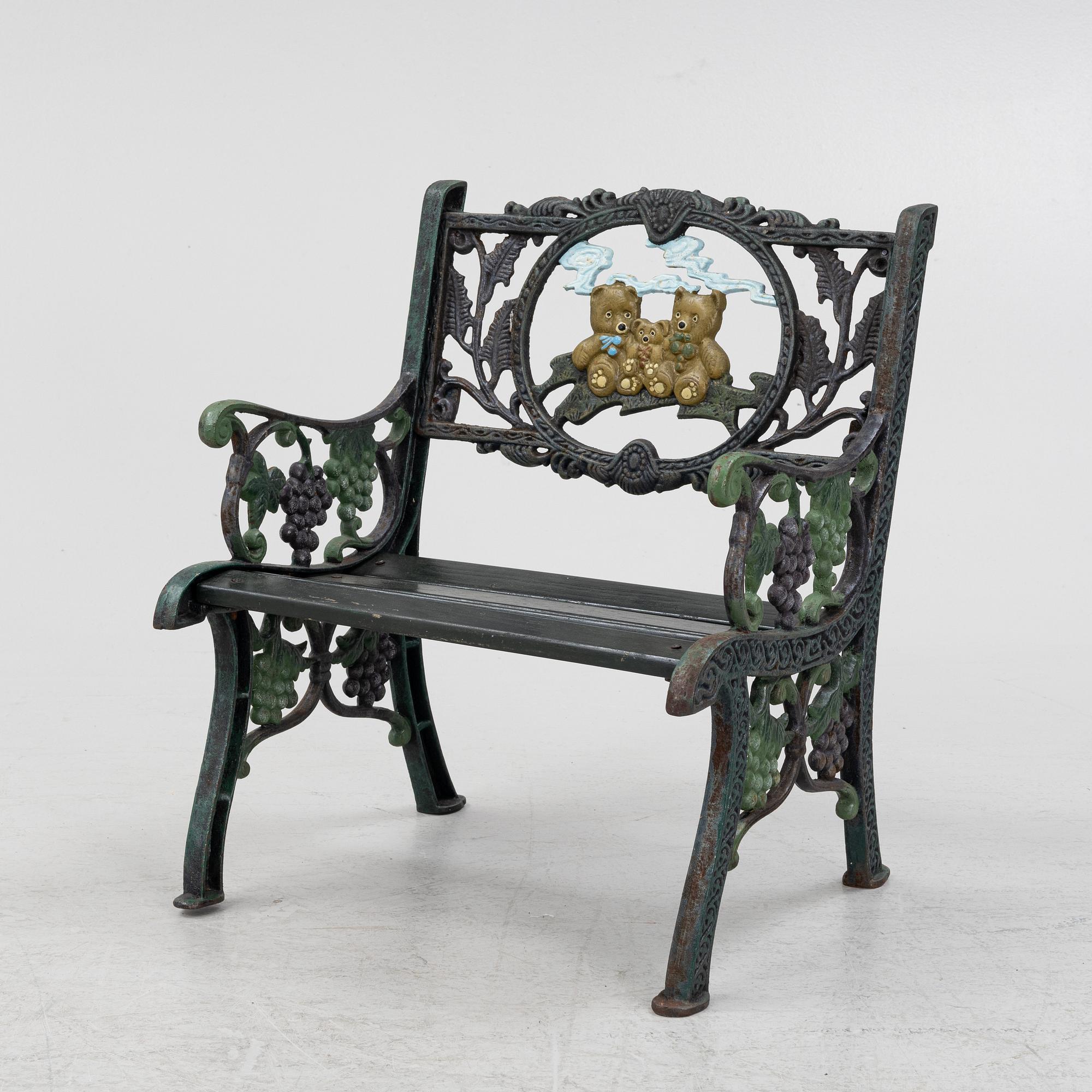 A children's cast iron garden sofa and armchair, mid 20th century.