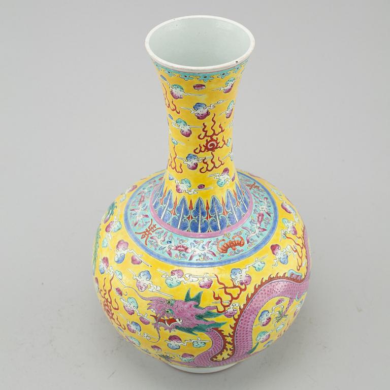 A yellow glazed dragon and phoenix vase, China, circa 1900.