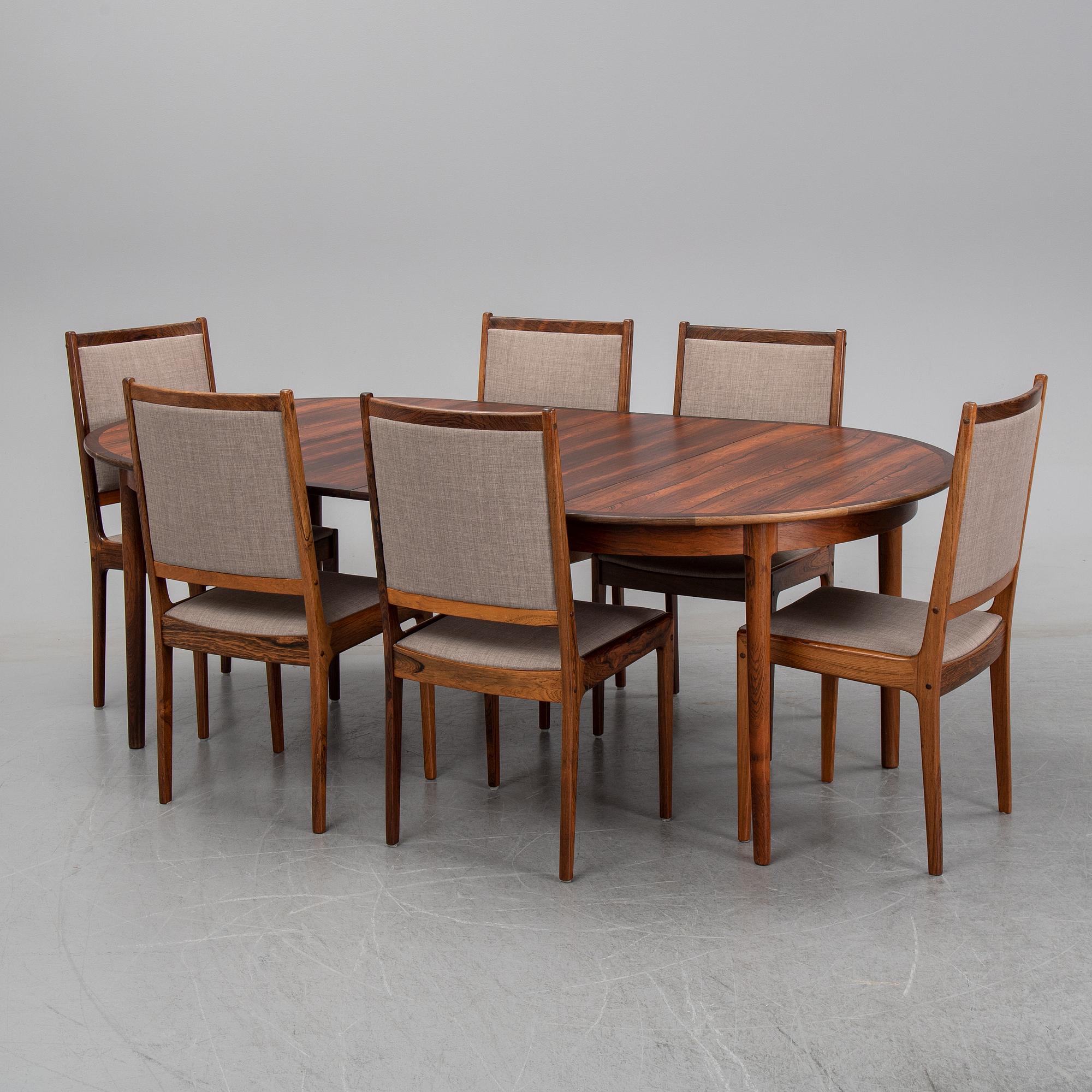 A seven-piece rosewood dining suite, 1960's/70's.