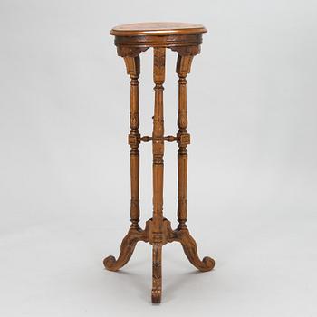 A carved wooden pedestal, late 19th century.