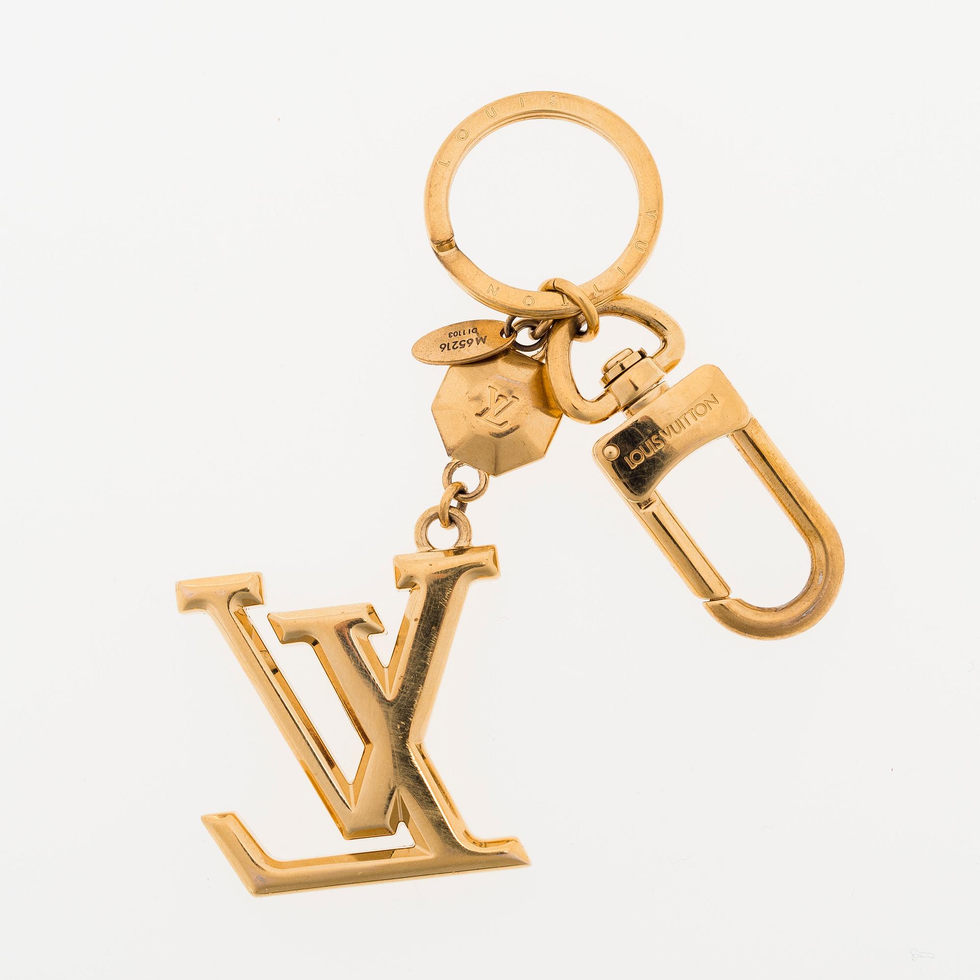 A Louis Vuitton bag charm.