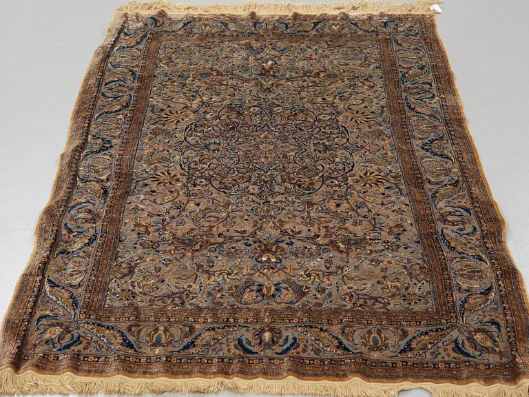 A RUG. A semi-antique silk Kashan Souf (in relief). 210 x 131,5 cm (as well as one cm flat weave at each end).