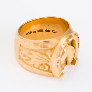 A 18K gold ring with a horseshoe and horse, Finland 1970.