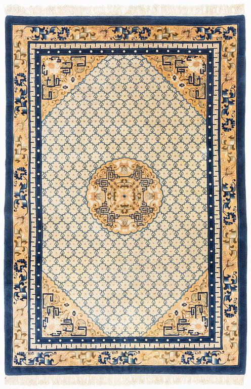 A carpet, China, antique finish, ca 275 x 185 cm.
