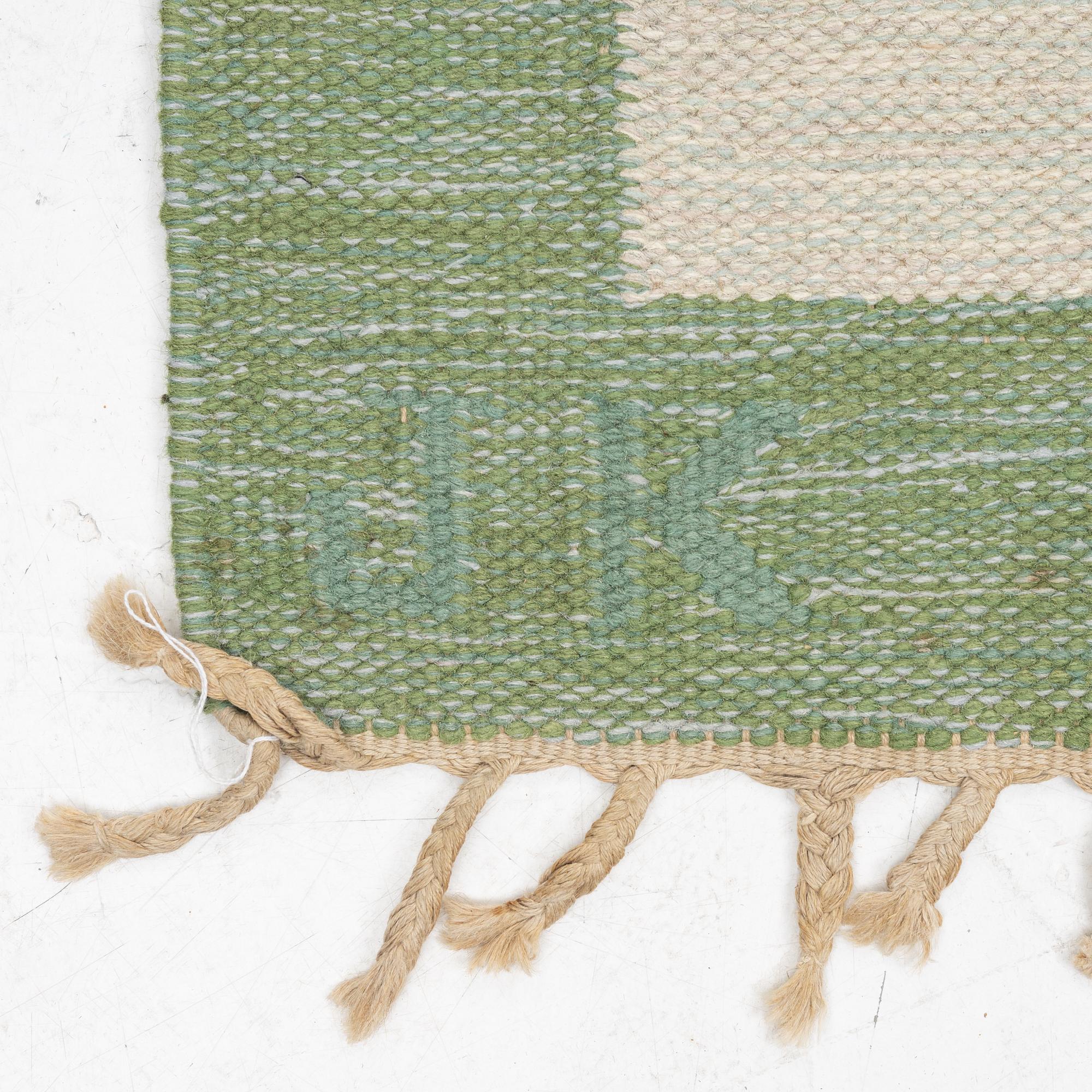 Karin Jönsson a carpet c 310 x 203 cm signed JK.