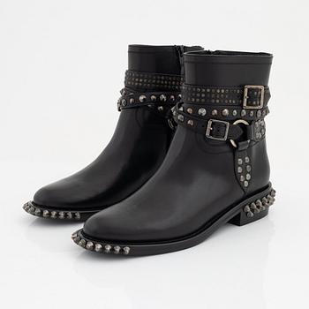 Yves Saint Laurent, a pair of black leather and studs boots, size 38.