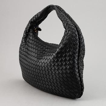 Bottega Veneta, a black leather bag.