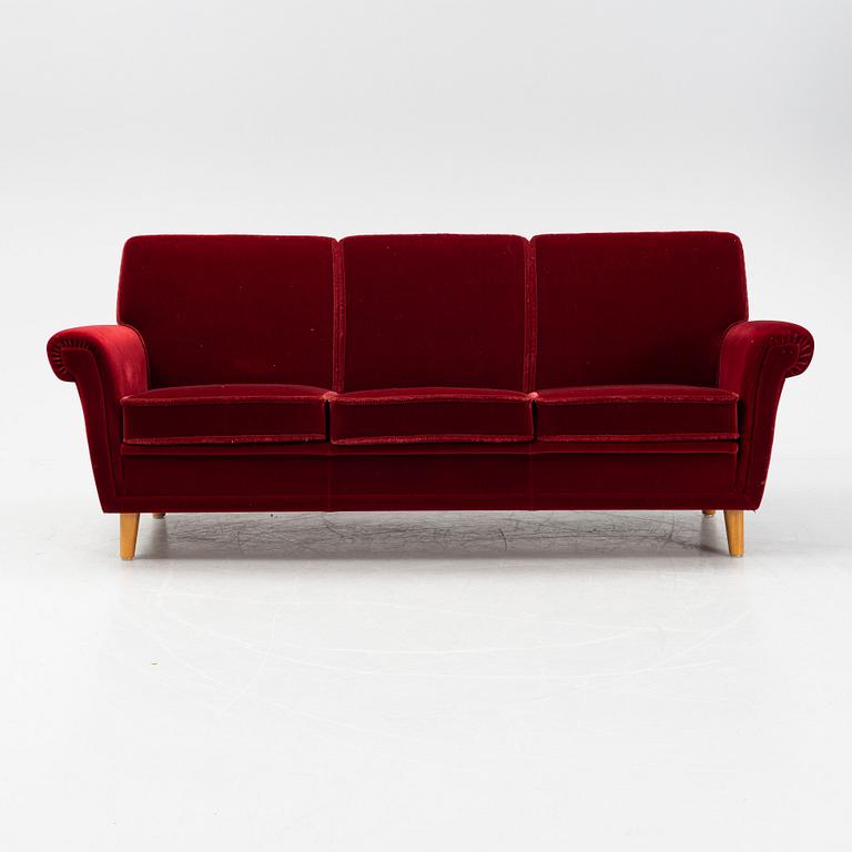 A velvet upholstered sofa, mid 20th Century.