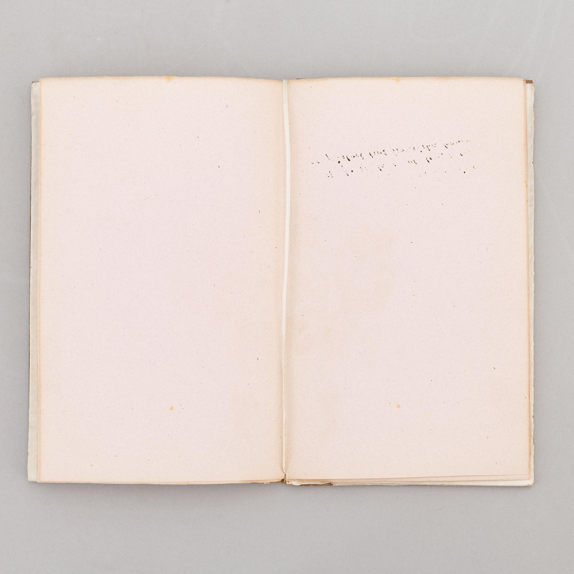 A keepsake book embellished by Ellen Jolin featuring a 'Santa Claus' figure.